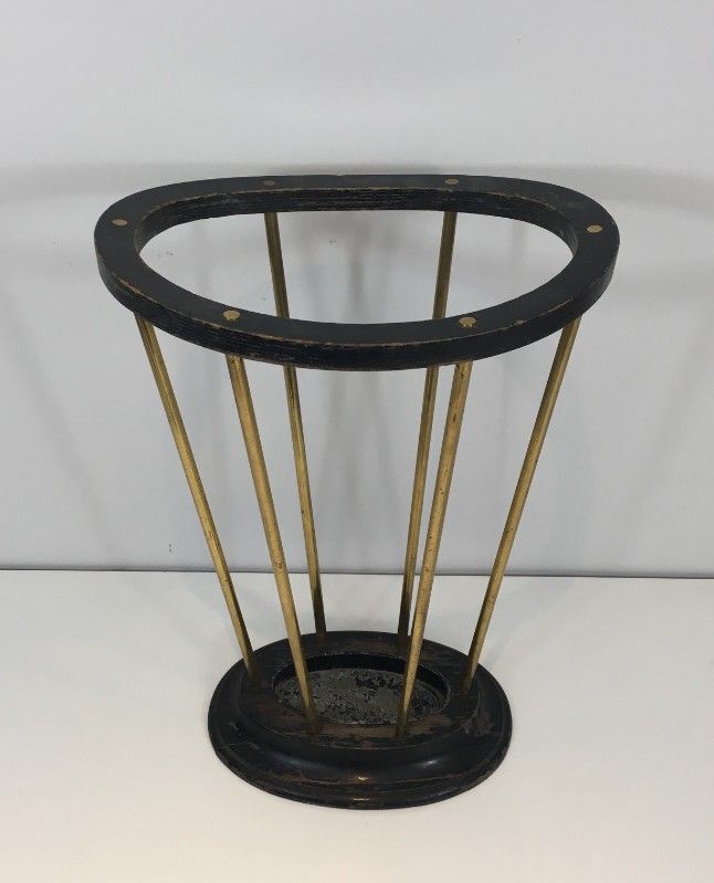 Umbrella stand in blackened wood and brass. Attributed to Jacques Adnet