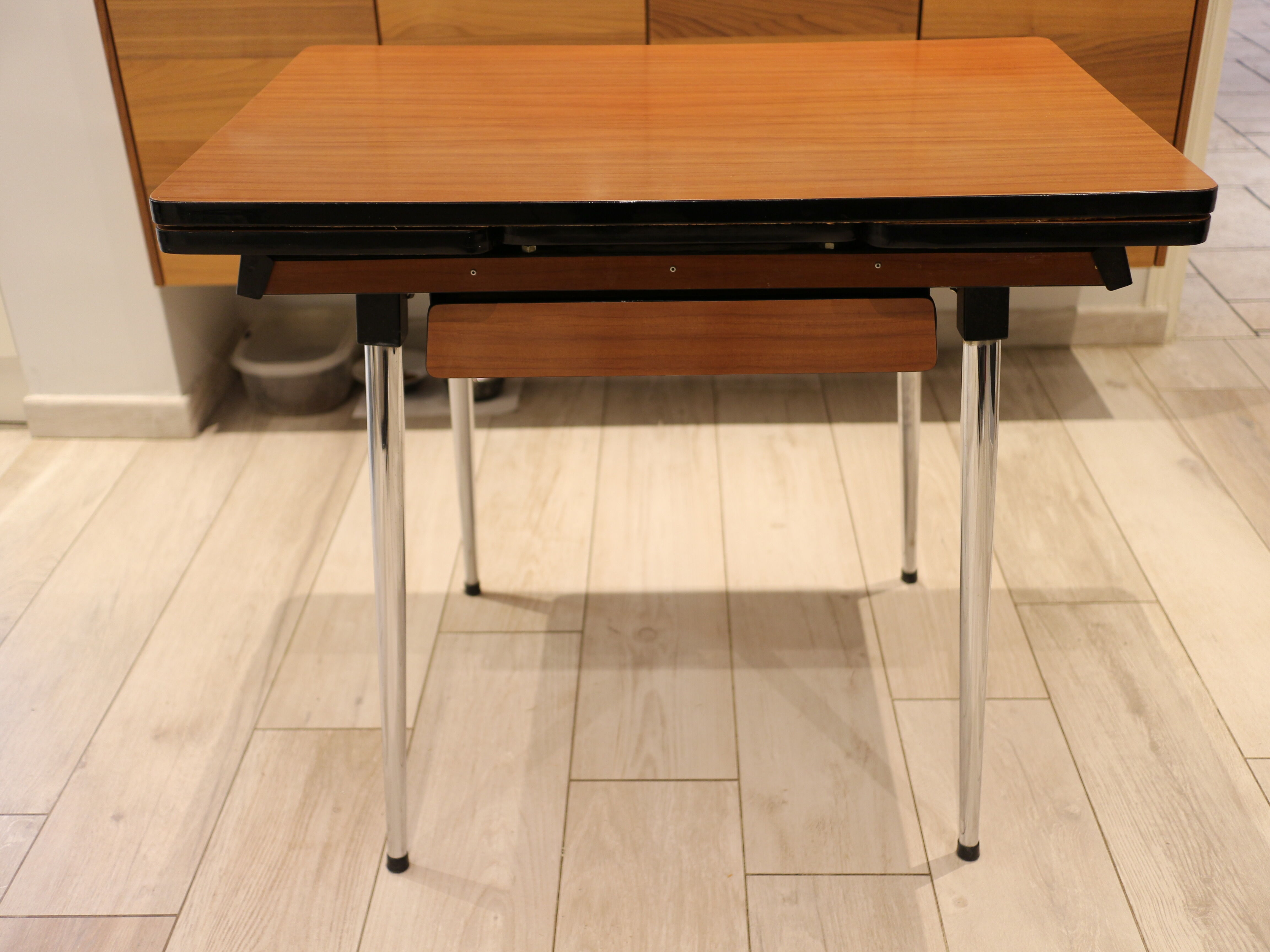 Briwn Formica table with extension cords and drawer