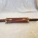 Vintage cutting service with knife and fork in wooden sheath