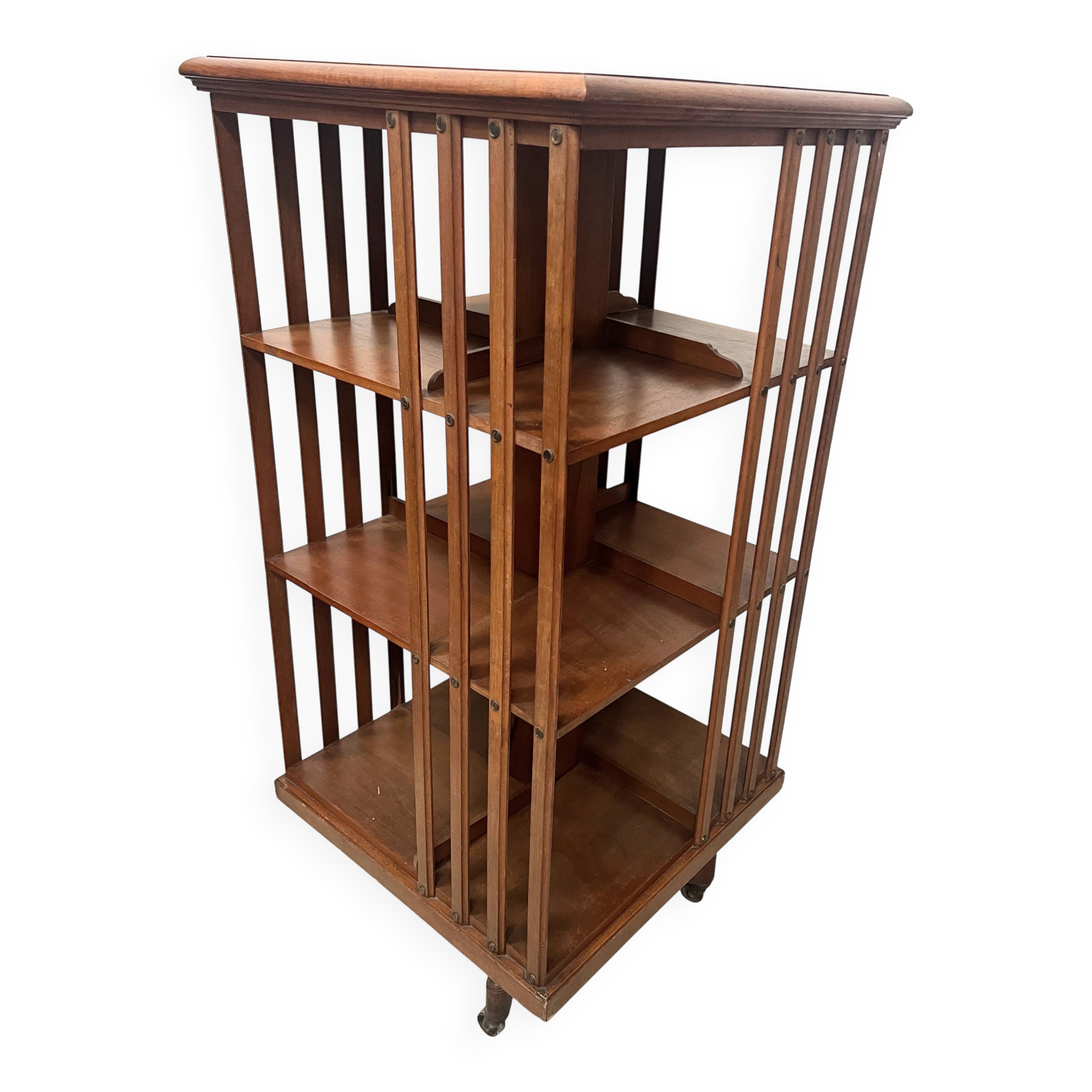 Rotating library in solid walnut, 20th century.