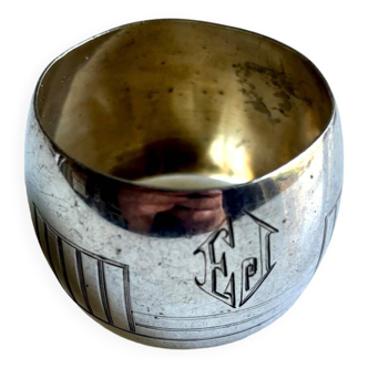 Napkin ring monogrammed “EJ” in silver metal