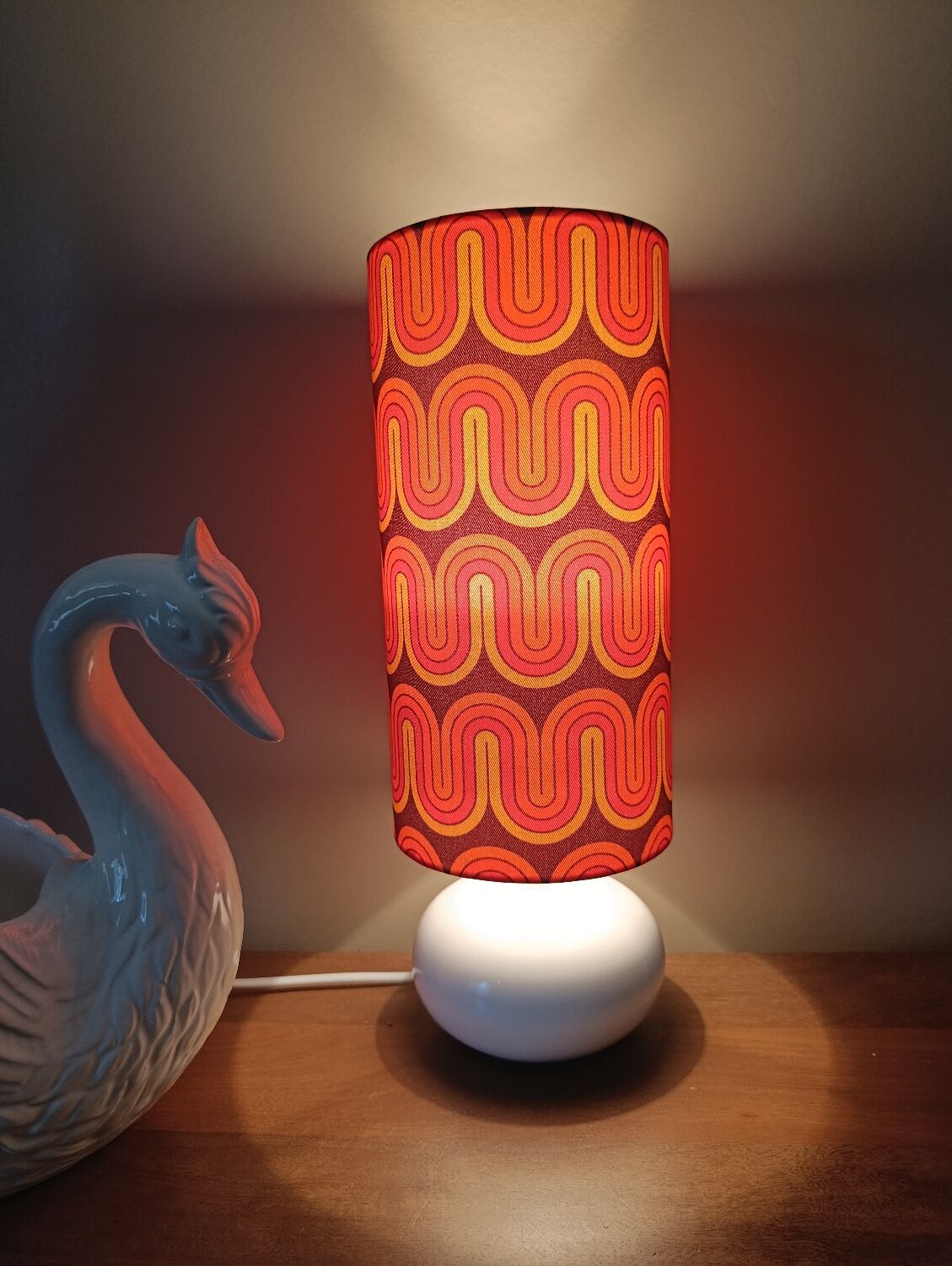 Two lamps with a seventies psychedelic wave print.