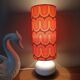 Two lamps with a seventies psychedelic wave print.