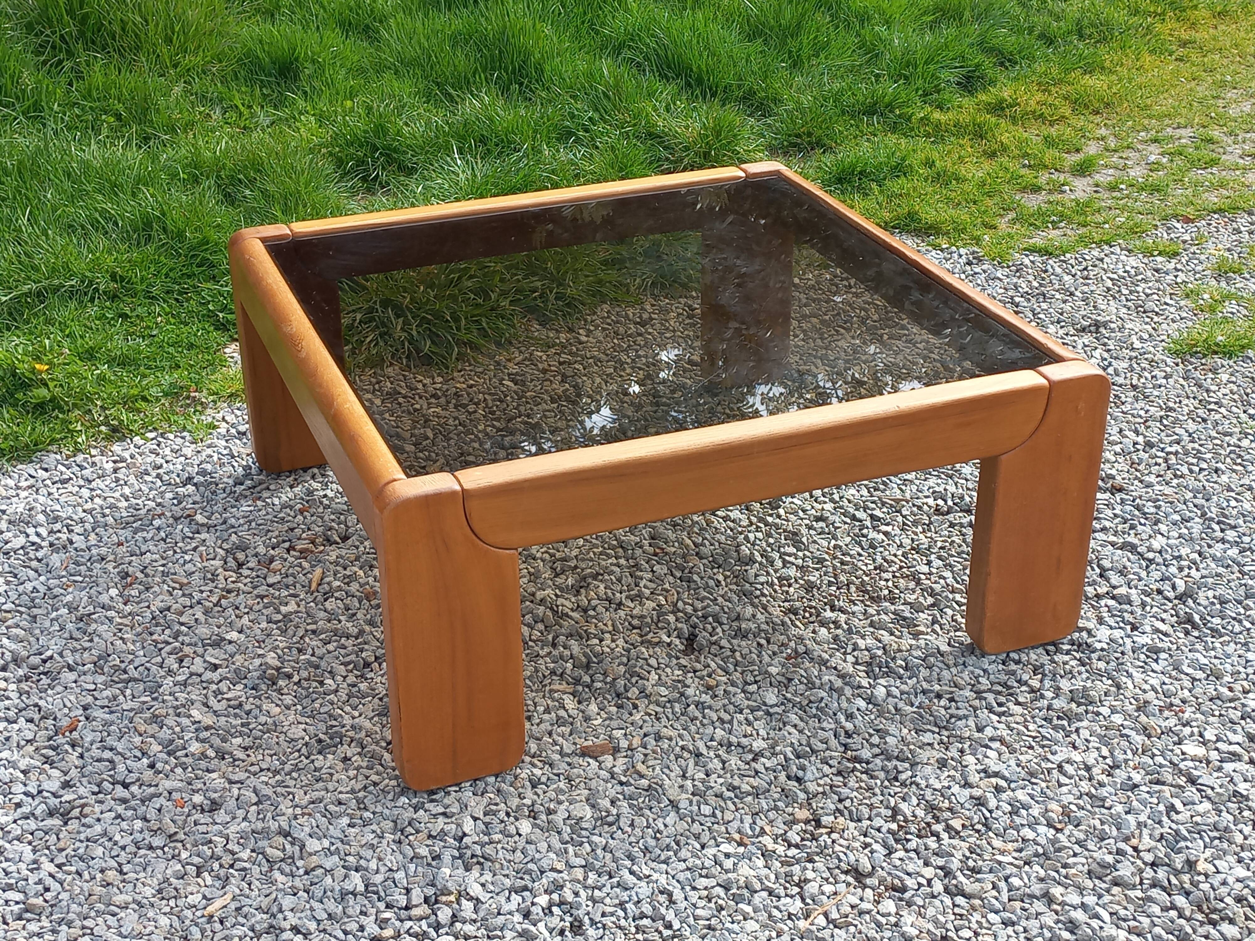 Coffee table from Regain in solid elm with a smoked glass top.