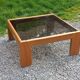 Coffee table from Regain in solid elm with a smoked glass top.