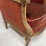 Two Louis XVI style wing chairs in gilded wood, 20th century