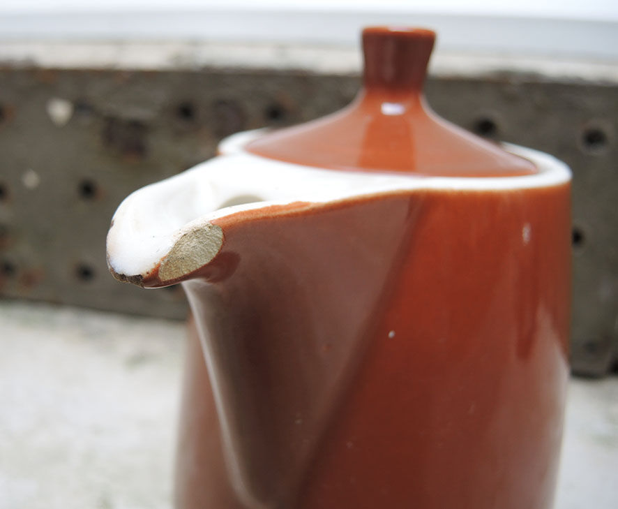 Old brown ceramic coffee maker