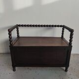 Natural wood chest forming a bench, ringed shoulders