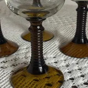 Footed glasses of the Roemer type, amber colour