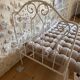 Small renovated wrought iron bed
