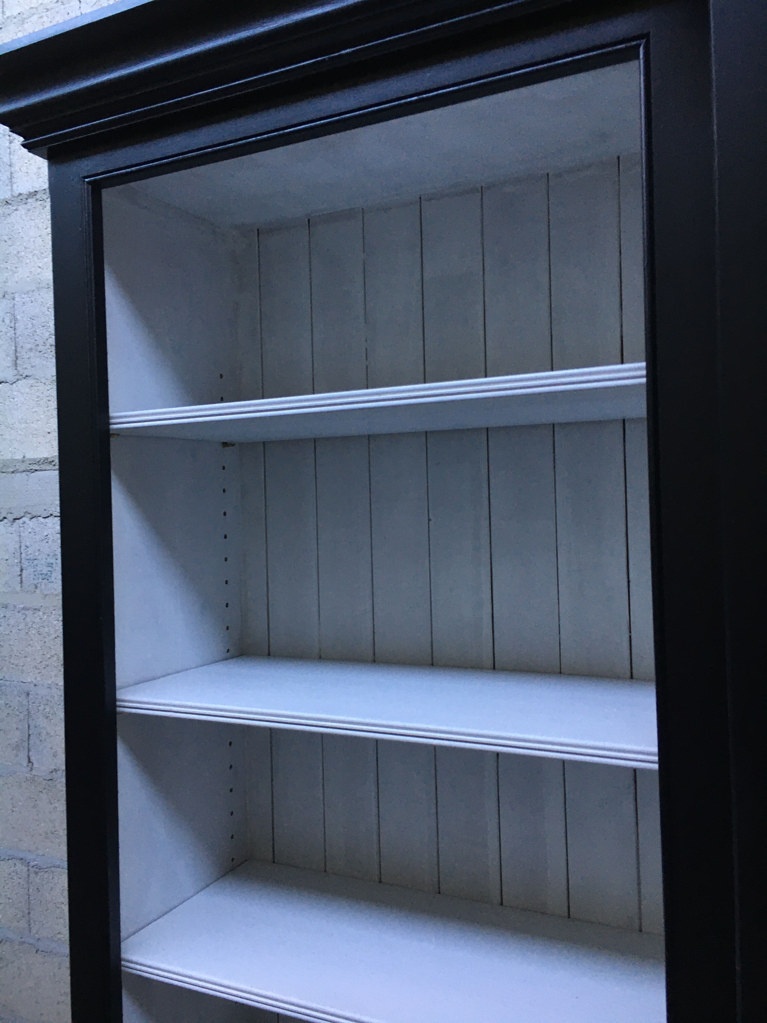 Black patinated wooden bookcase