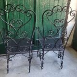 Pair of black wrought iron armchairs