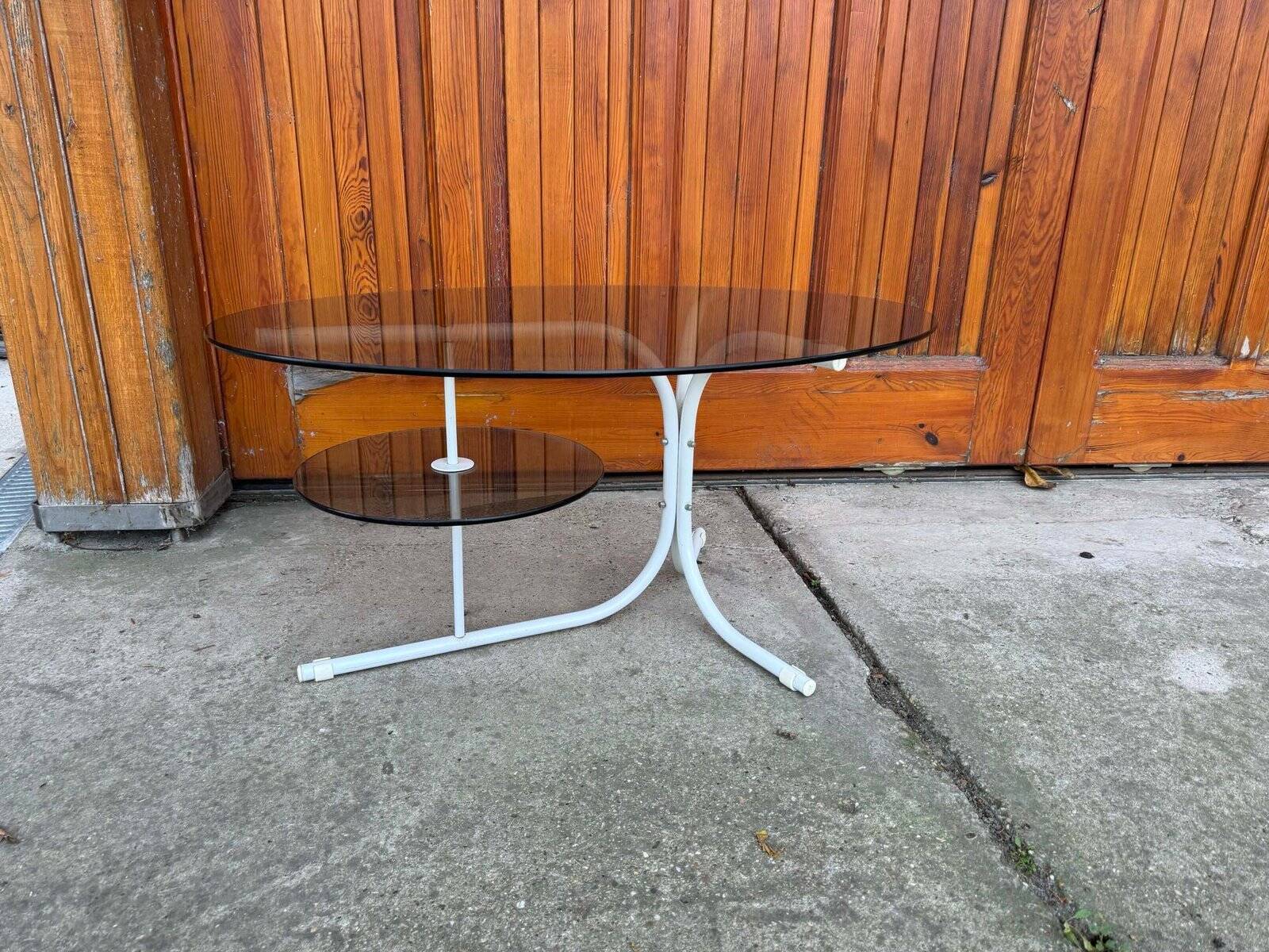 Oval smoked grey glass coffee table with white metal legs - 1990s vintage style.