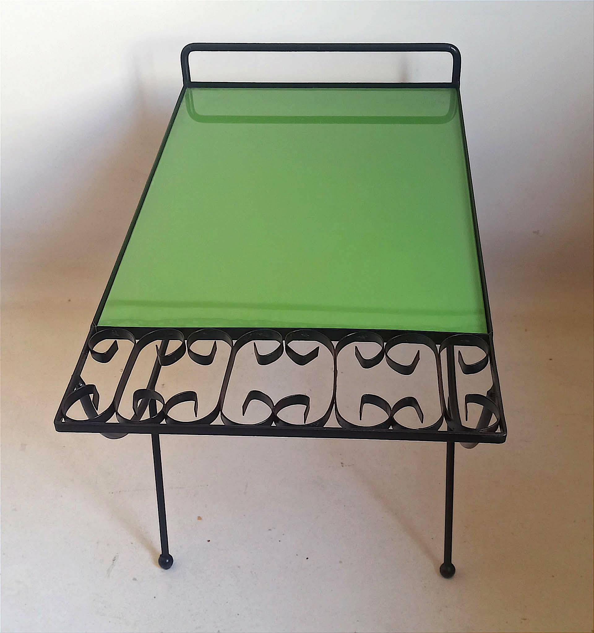 1960s side table with a lime green top, width 65.5 cm.