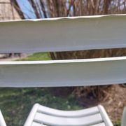 pair of white metal chairs, Tolix style