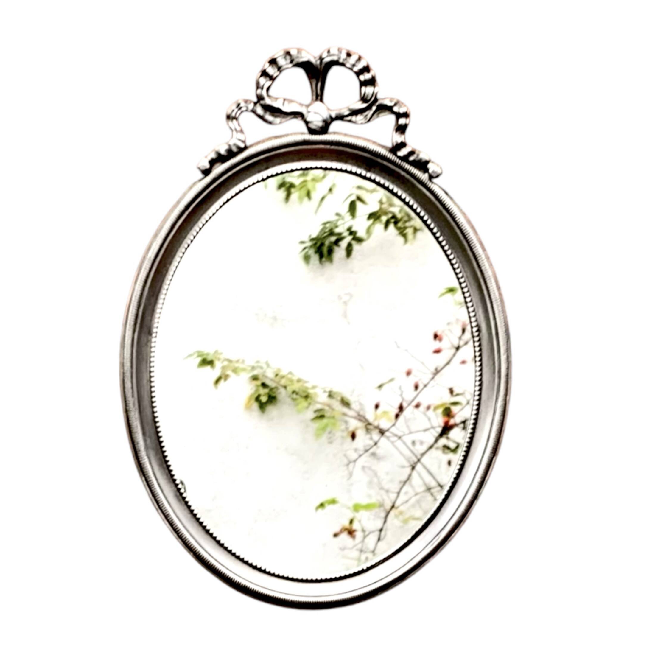 Louis XVI style oval metal wall mirror