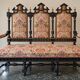 Historicist three-seater canapé in ebonised wood.