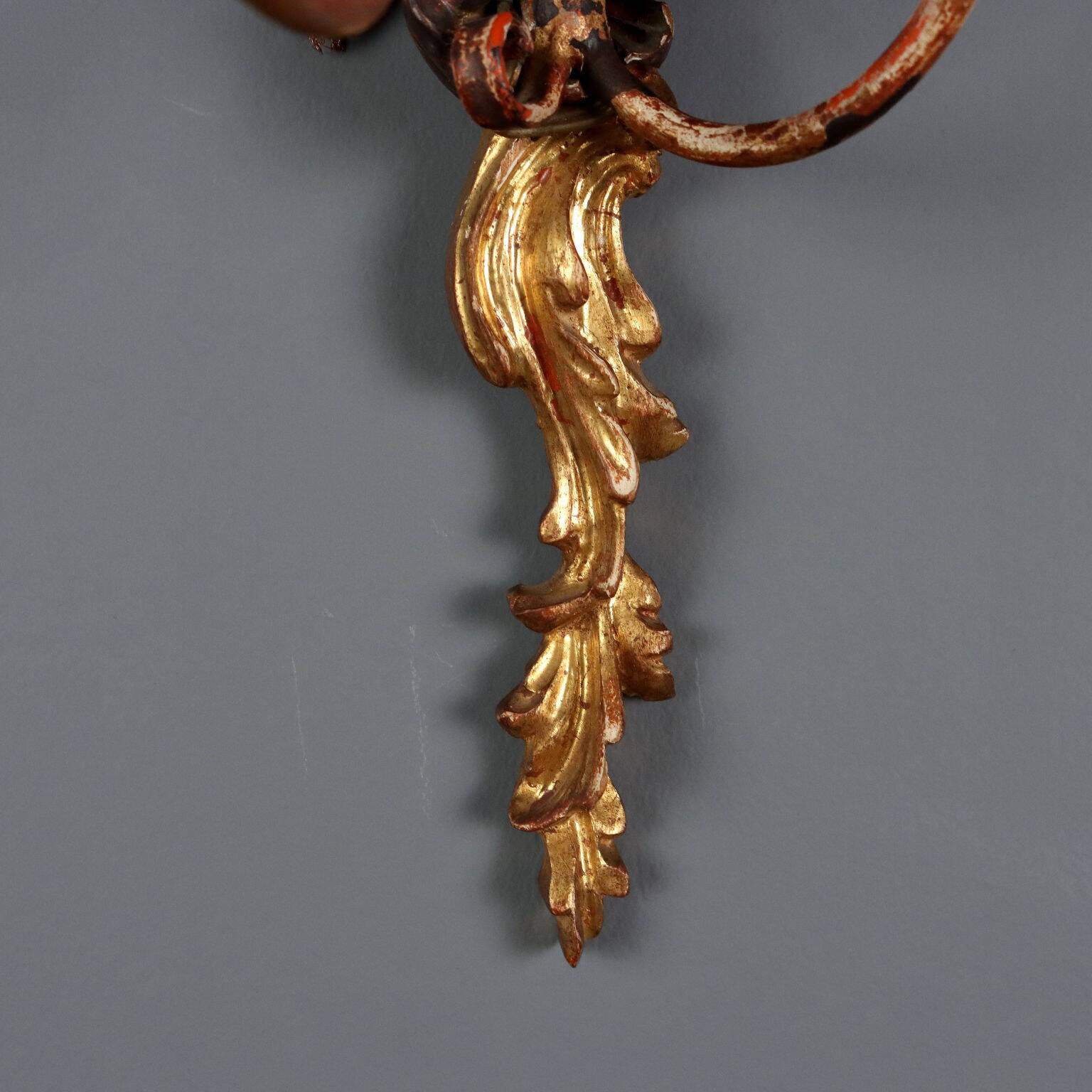 Antique wall sconces in carved lacquered and gilded wood, Italy, 20th century.