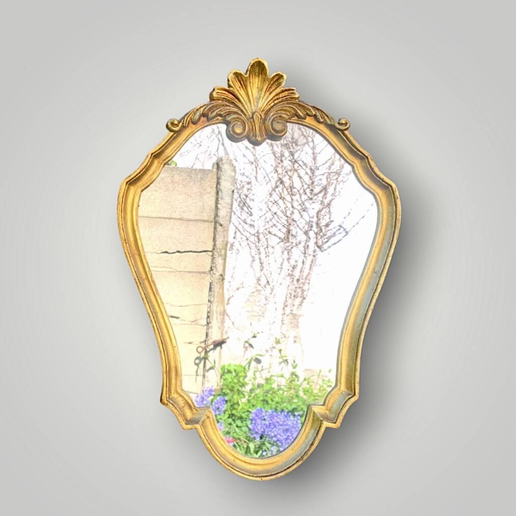 Vintage wall mirror with golden resin shell