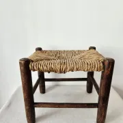 Small rustic vintage wooden and straw stool -