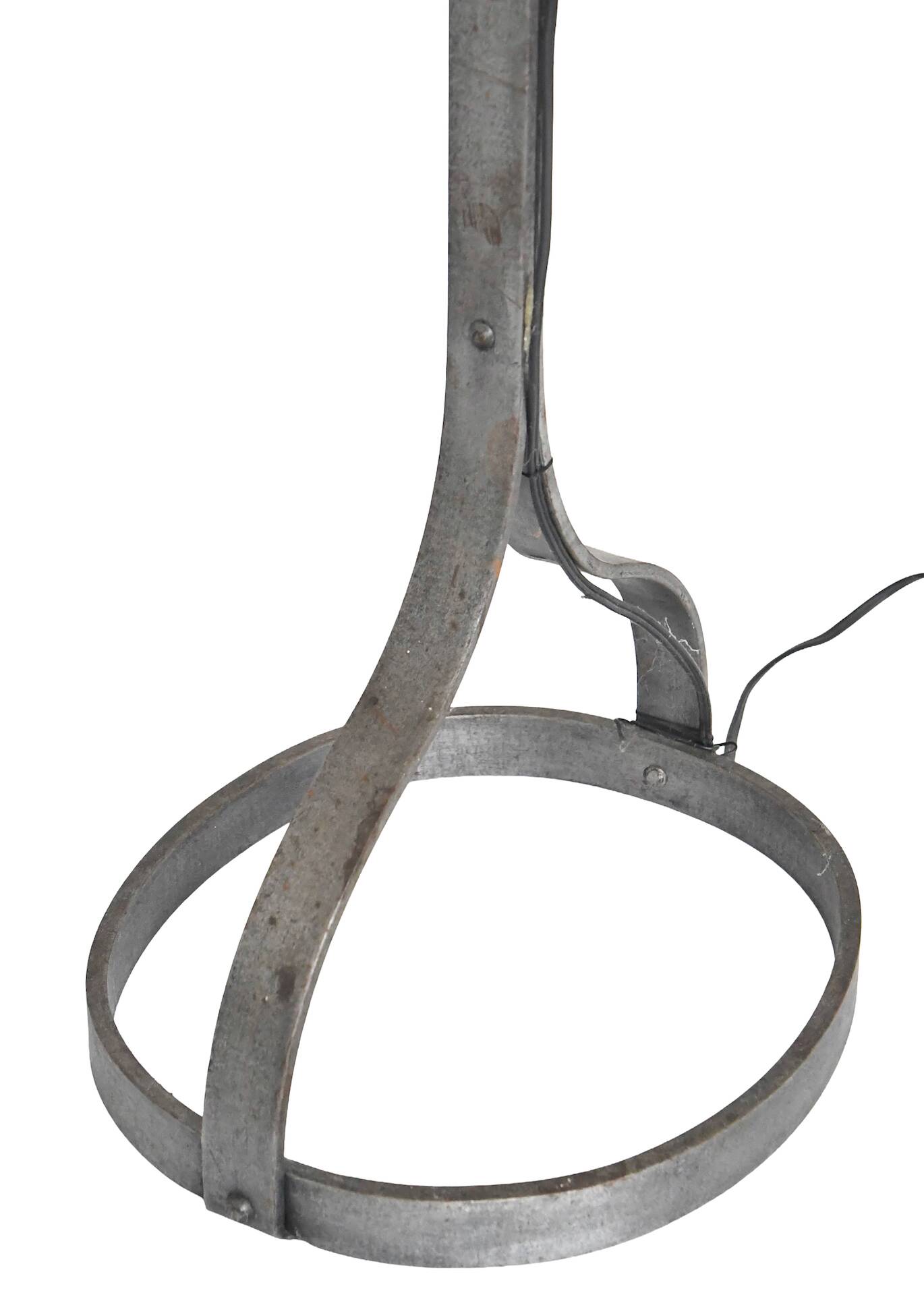 Wrought iron and leather floor lamp in the style of Jean-Pierre Ryckaert.