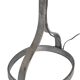 Wrought iron and leather floor lamp in the style of Jean-Pierre Ryckaert.