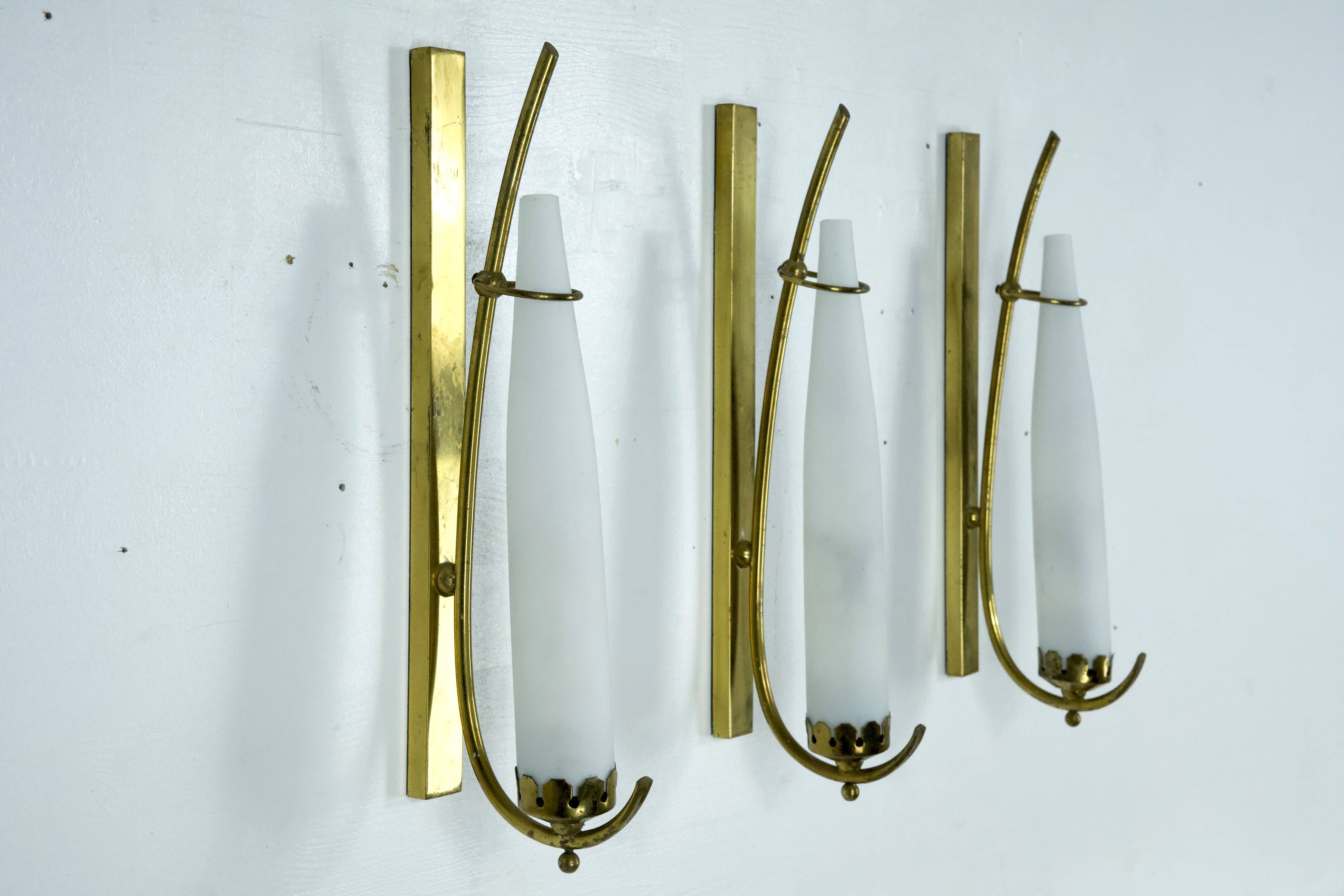 Set of three sconces in brass and triplex opaline glass. Italy 1950s