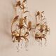 Hand-forged wall lamp gilded with gold leaf and crystals, Italy