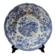 Old deep plate with blue floral pattern and gallant scene