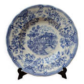 Old deep plate with blue floral pattern and gallant scene