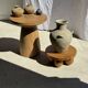 Light beige-grey Indonesian terracotta vase with 4 small handles and a high neck.