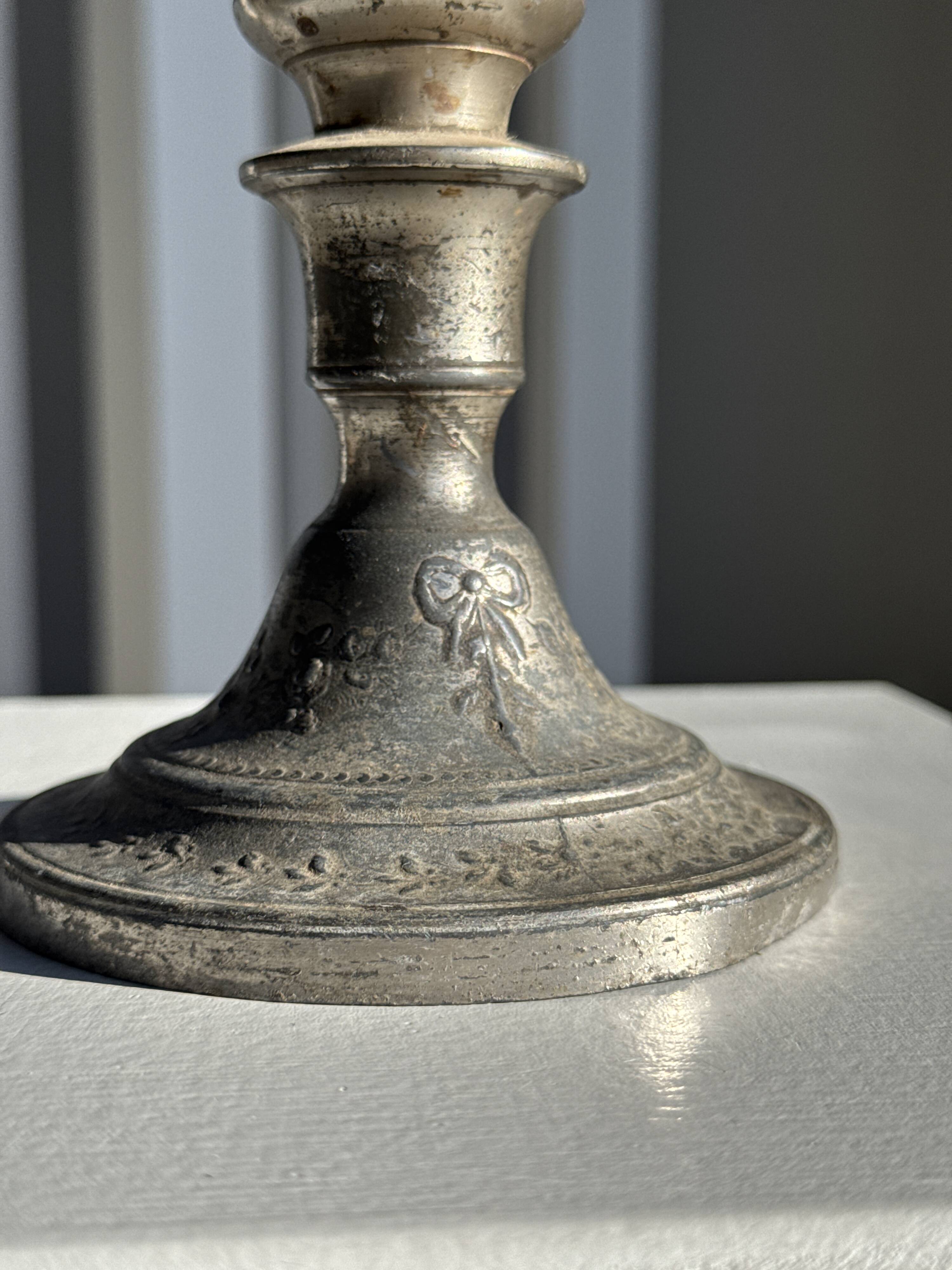 Small antique candle holder engraved in silver-plated metal, in its original condition.