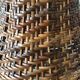 Enamelled ceramic lamp and rattan