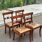 4 Regency chairs in solid wood and brown-beige leather from the 19th century.