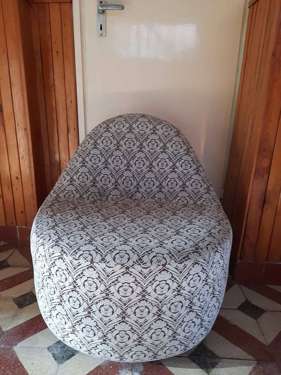 1970s vintage armchair in multicoloured patterned fabric, rounded silhouette