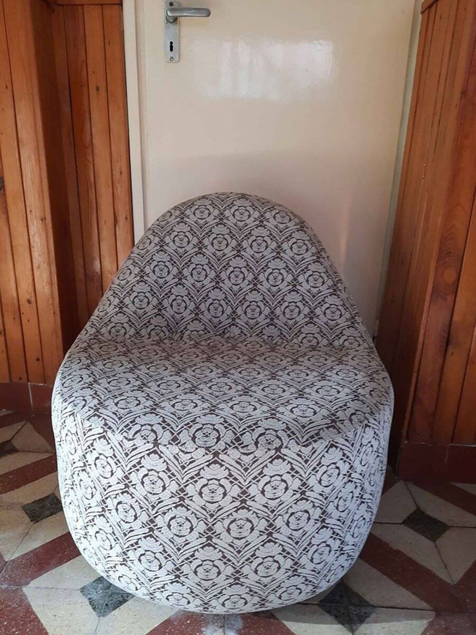 1970s vintage armchair in multicoloured patterned fabric, rounded silhouette