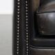 Fauteuil club noir/gris en cuir de mouton