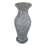 Structured glass vase with curved flowers