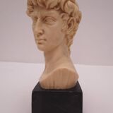 Small glass globe on base housing a figurine of “david”