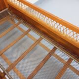 Vintage oak and rattan baby cot from the 1960s.