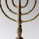 Vintage brass candlestick from the 1950s, seven-branched menorah with ornamental decoration.