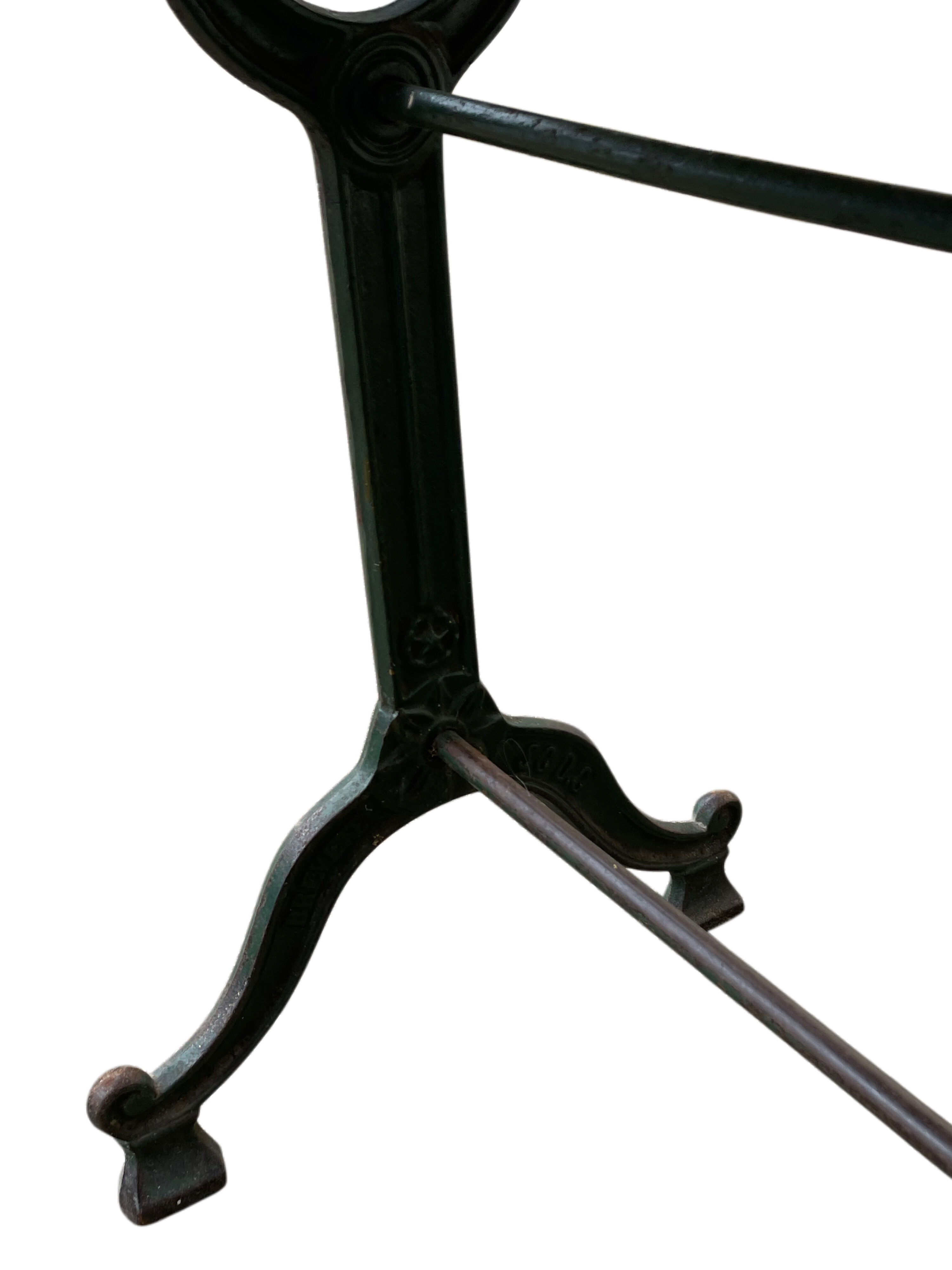 Old bistro table in engraved wrought iron