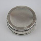 Small round box with silver pills
