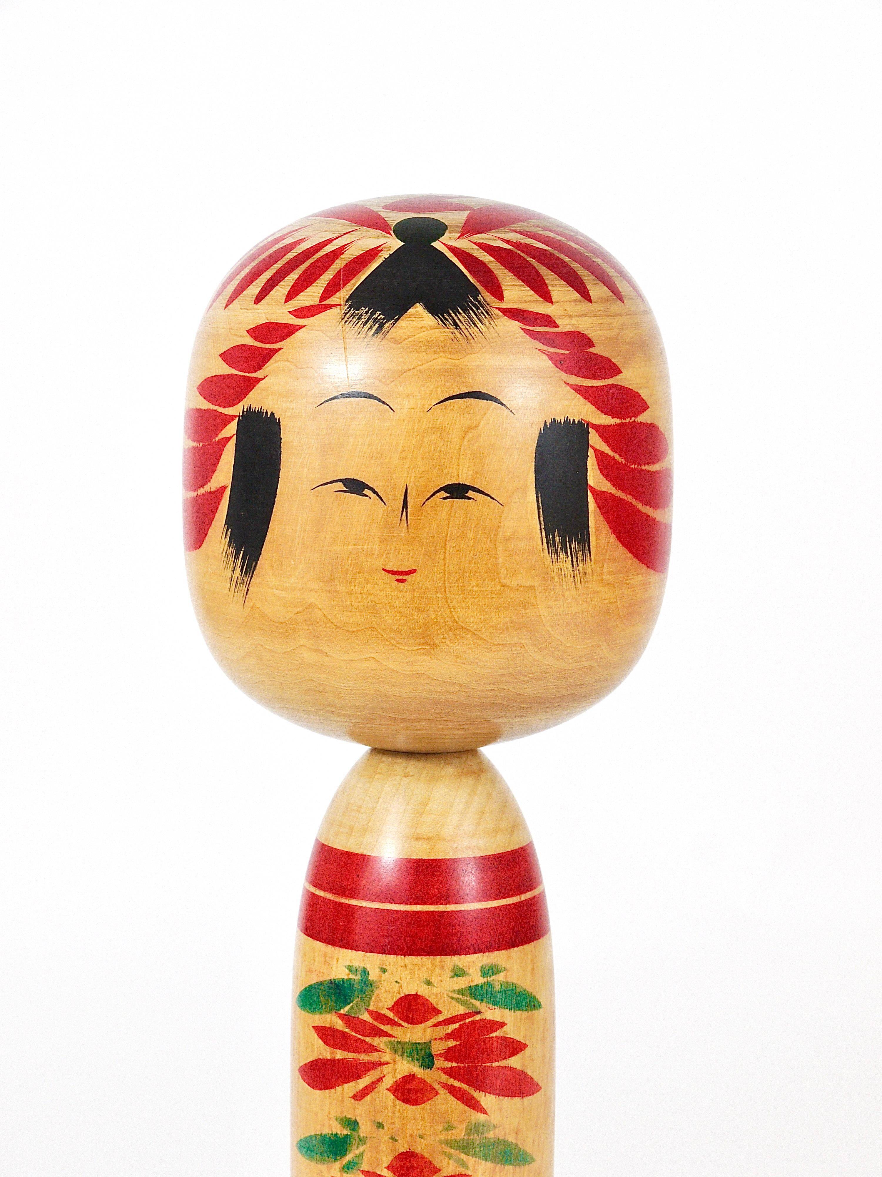 Decorative Togatta Kokeshi doll sculpture from northern Japan, hand-painted.