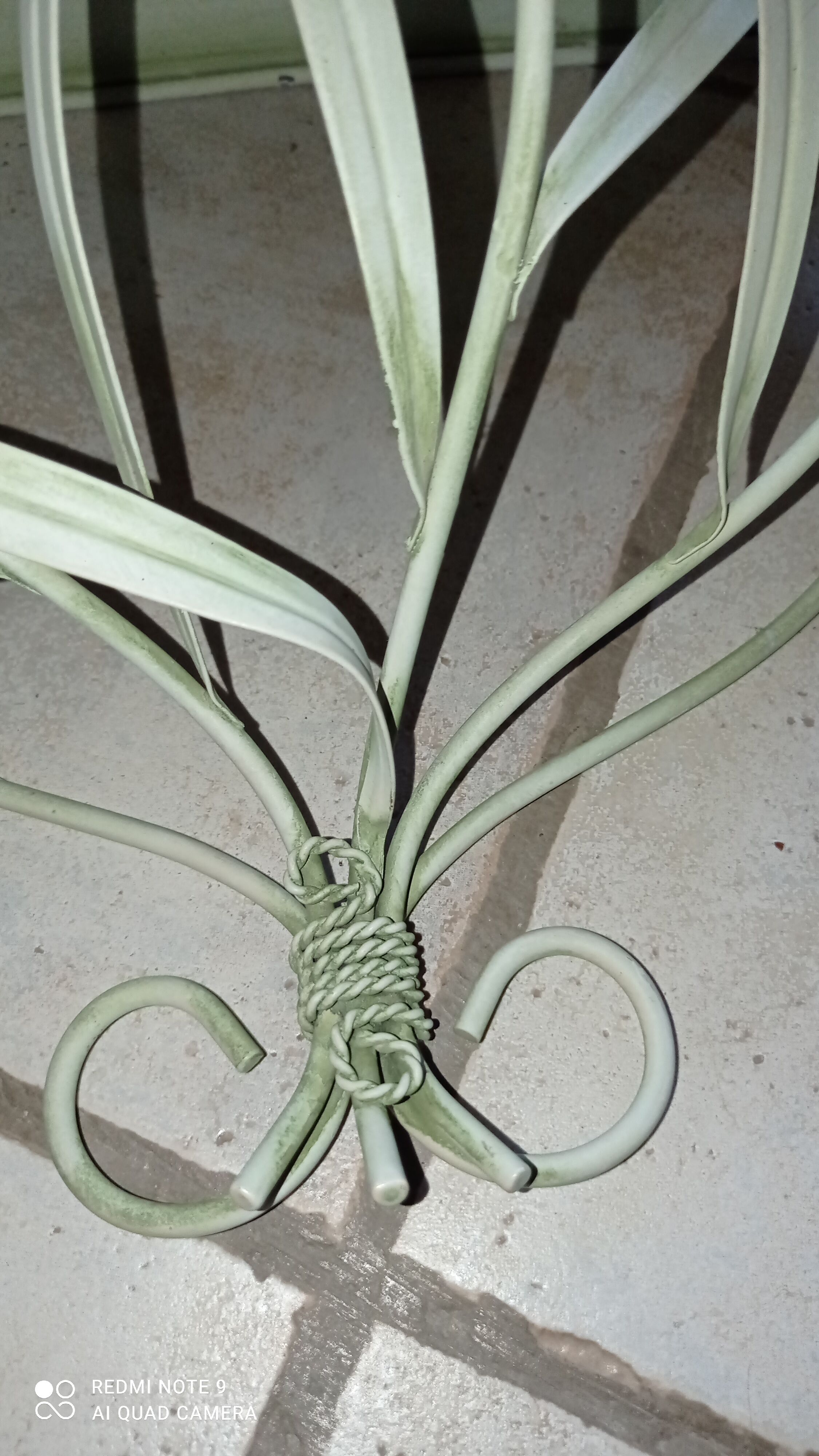 Duo of wrought iron shelves