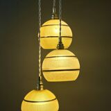 Suspension triple vintage glass globes in frosted yellow and gold.