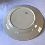 Round serving dish from the Longchamp earthenware factory, Doria model. Iron Land