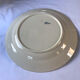 Round serving dish from the Longchamp earthenware factory, Doria model. Iron Land