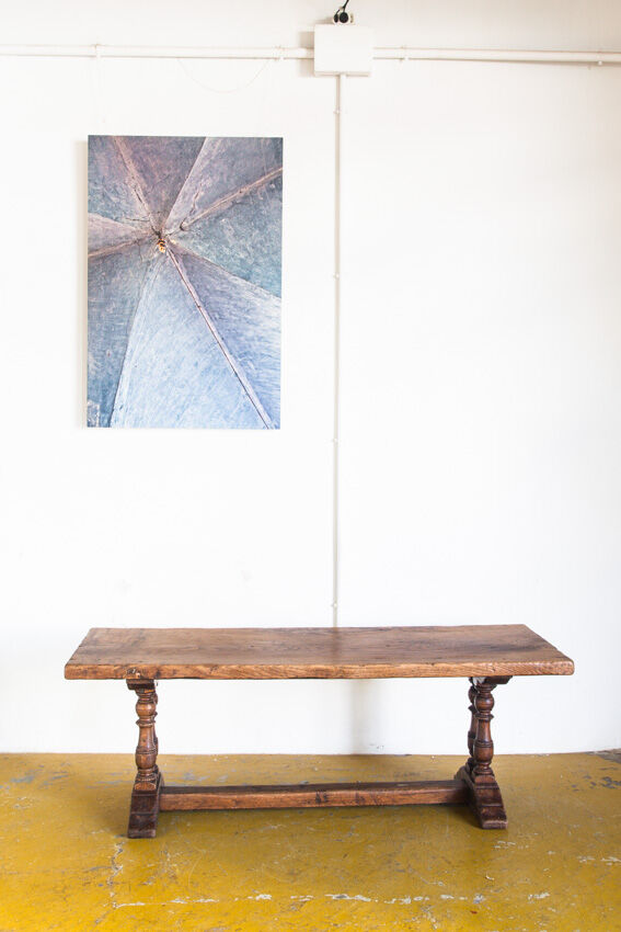 Old coffee table in solid oak wood. France, early twentieth century.