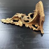 Golden console in rococo style